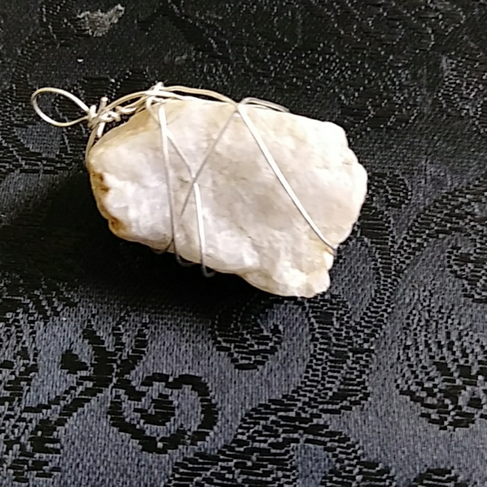 Wire wrapped healing stone pendant